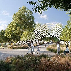 People walking along a green path with a sculptural structure overhead