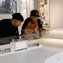 Father and son viewing Jackie Robinson Museum display