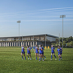 A group of people in uniform on a field.