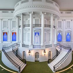 A large white building with many columns.
