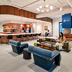 Interior photo of a group of people interacting in a room.