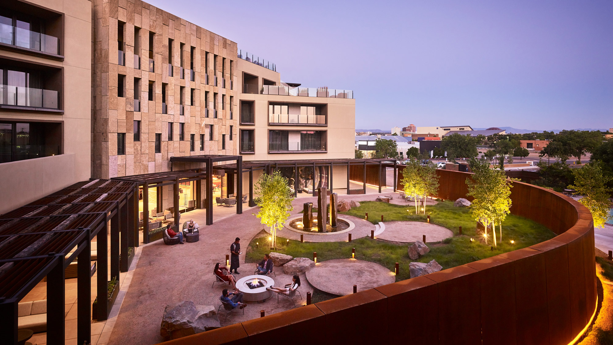 A courtyard with a building in the background.