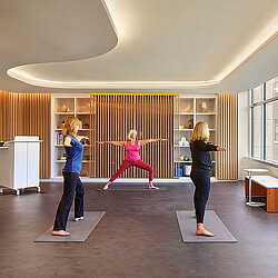 A group of women exercising in a room.