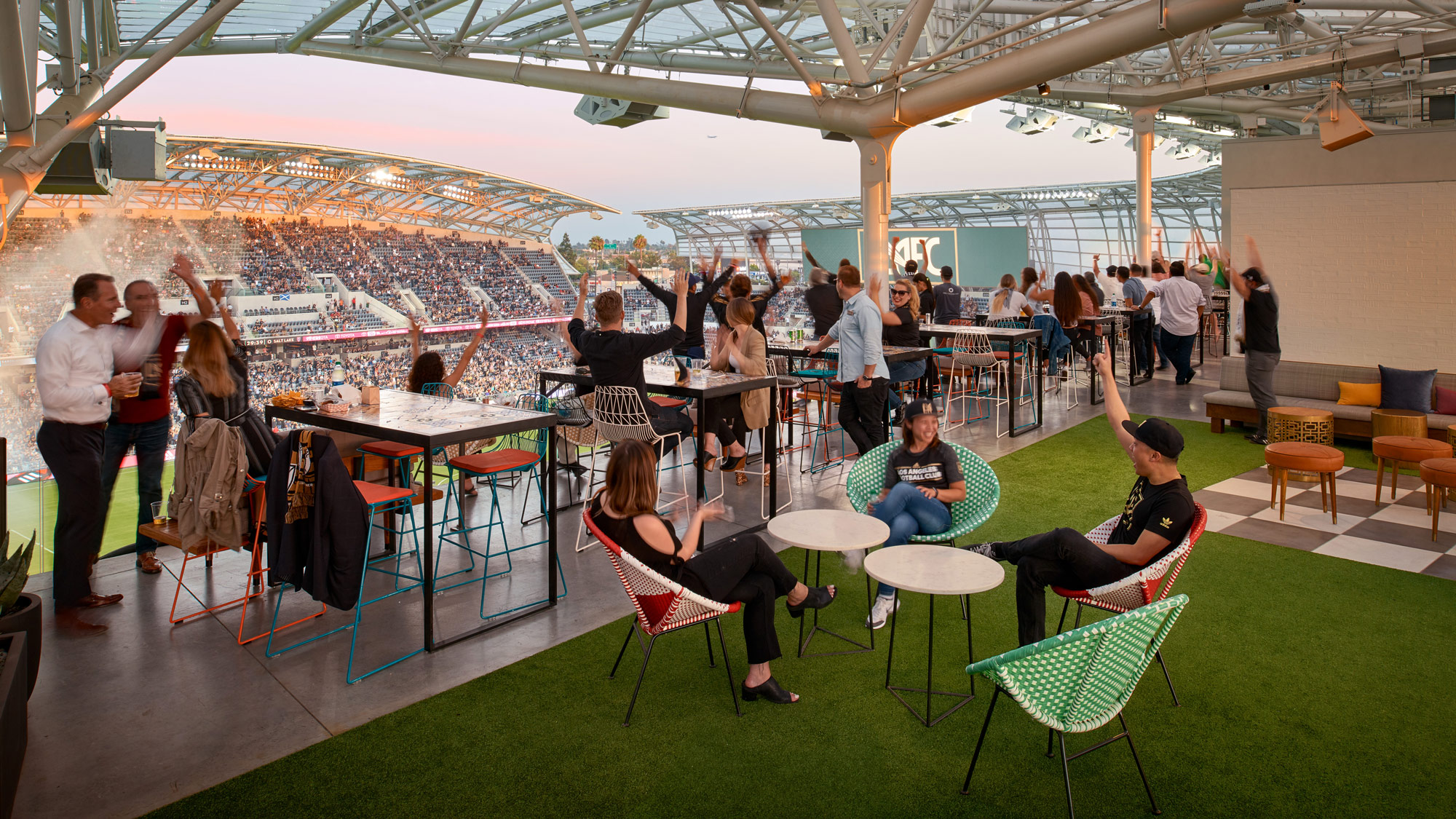 A group of people sitting at tables.