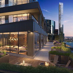 A building with a pool and a tall tower in the background.