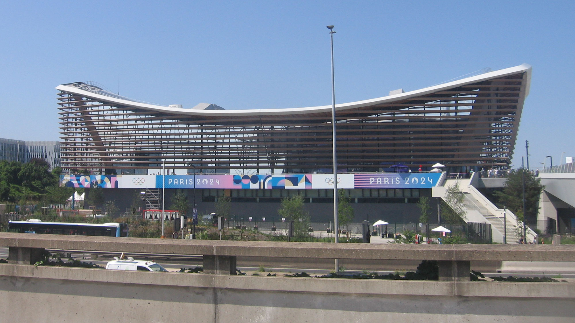 A large stadium with a large roof.