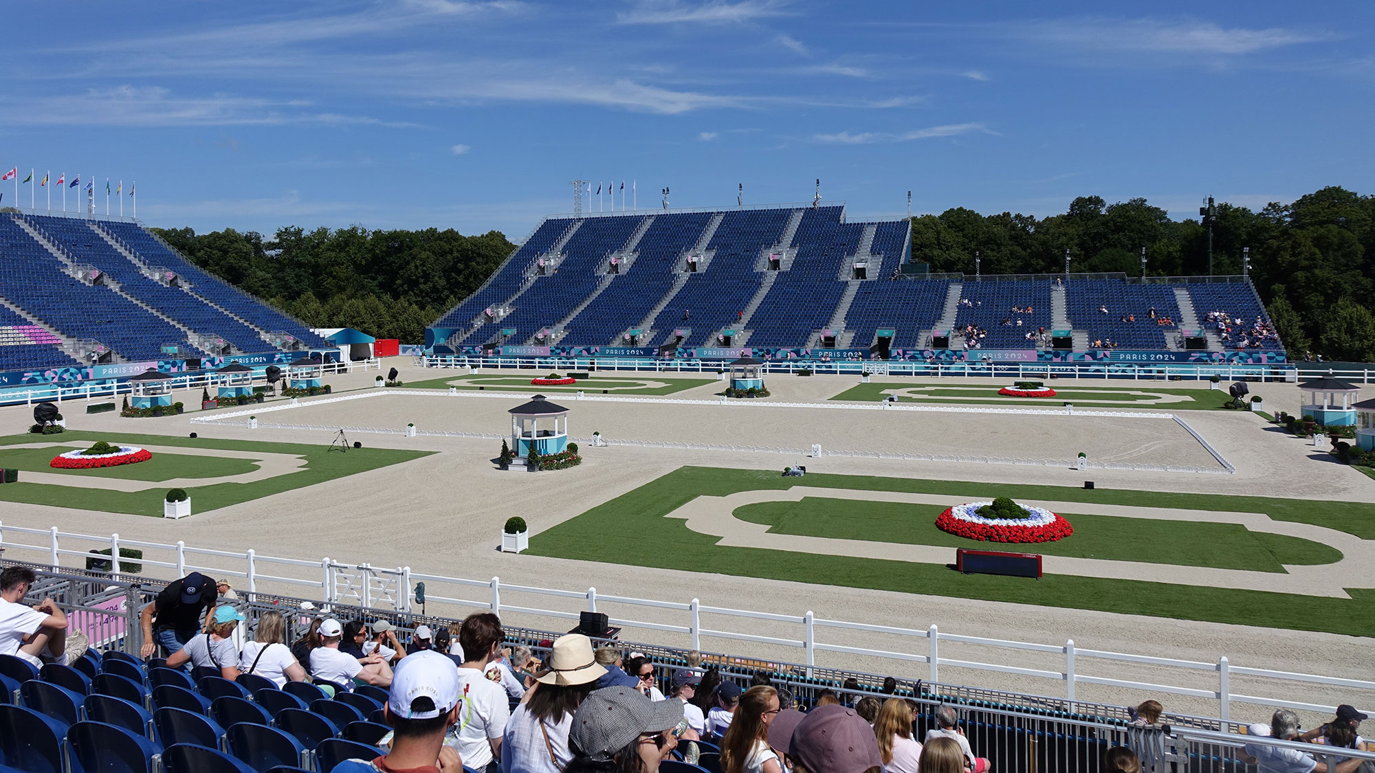 A race track with a crowd watching.