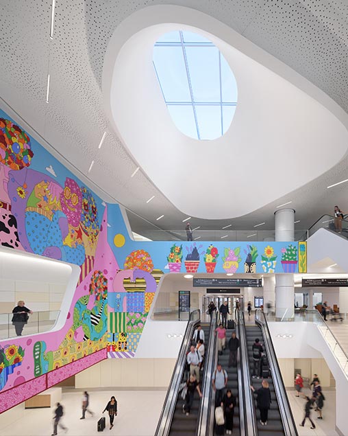 SFO Terminal 1 renovation interior with wall art and sky light