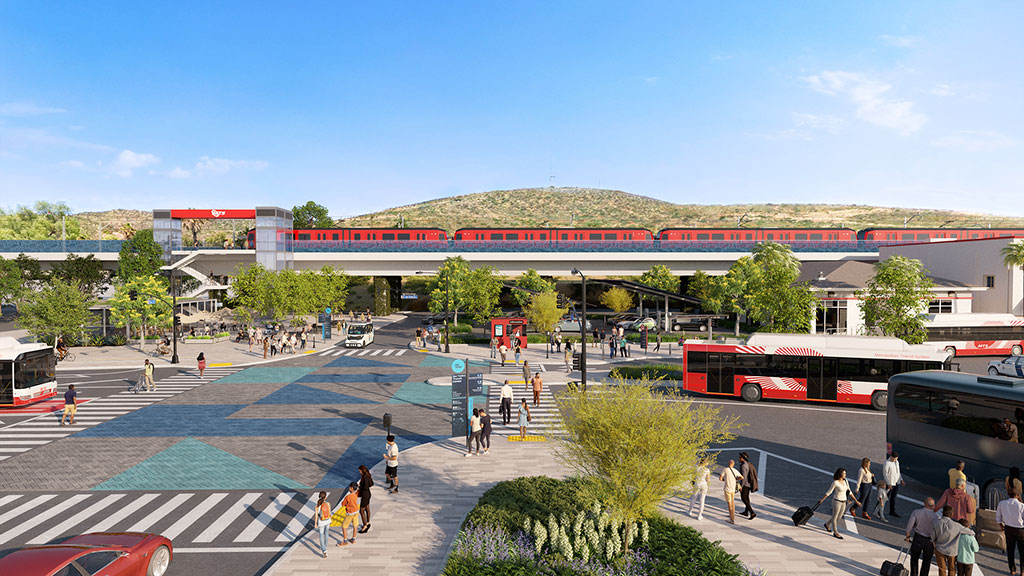 A train station with people walking around.