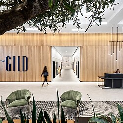 A person walking in a lobby.