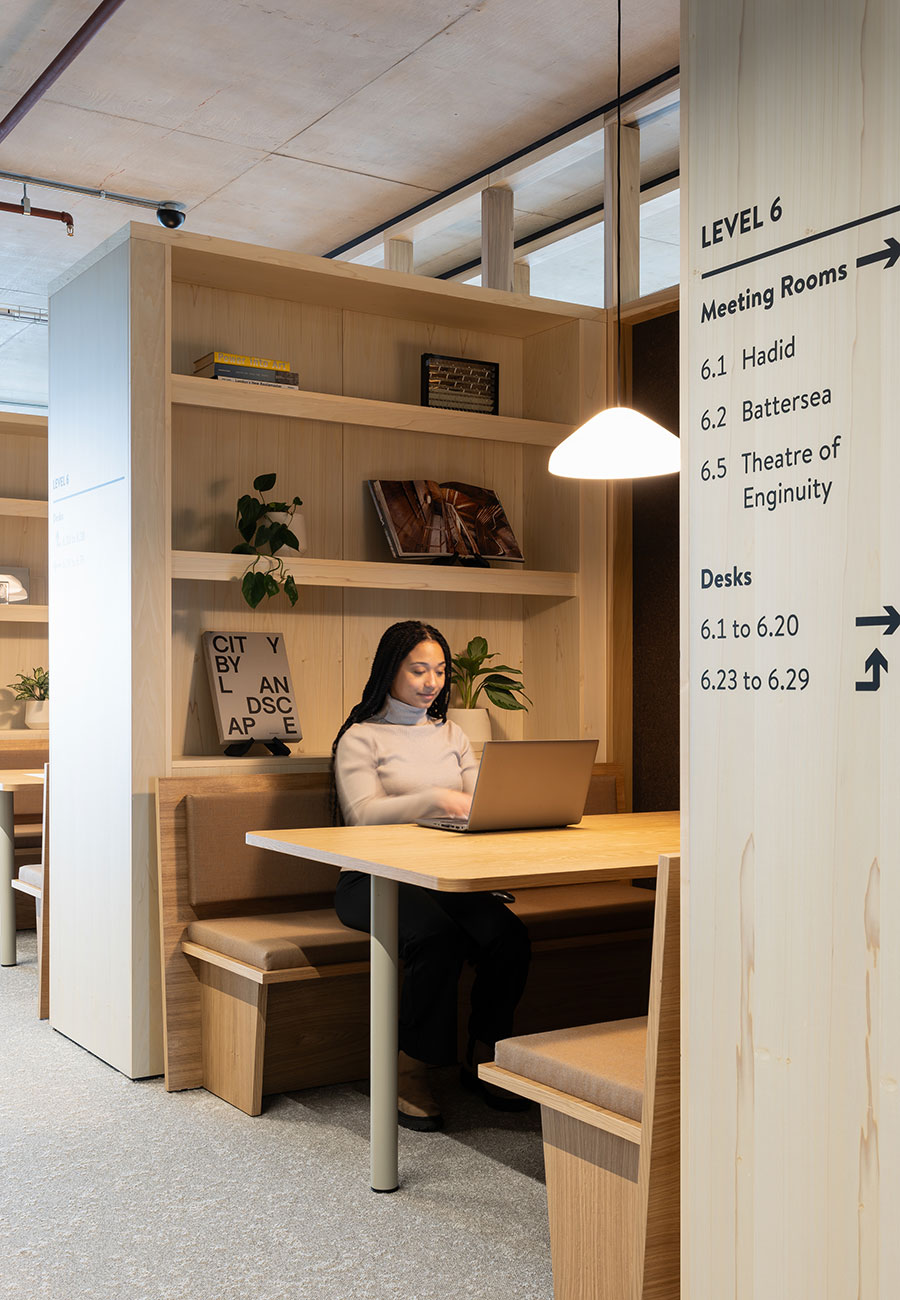 A person sitting at a desk with a laptop.
