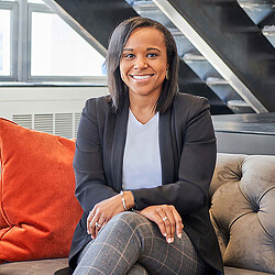 A woman sitting on a couch.