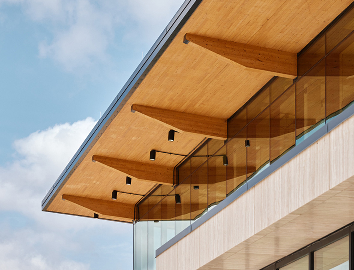 Mass timber roof close-up against blue sky