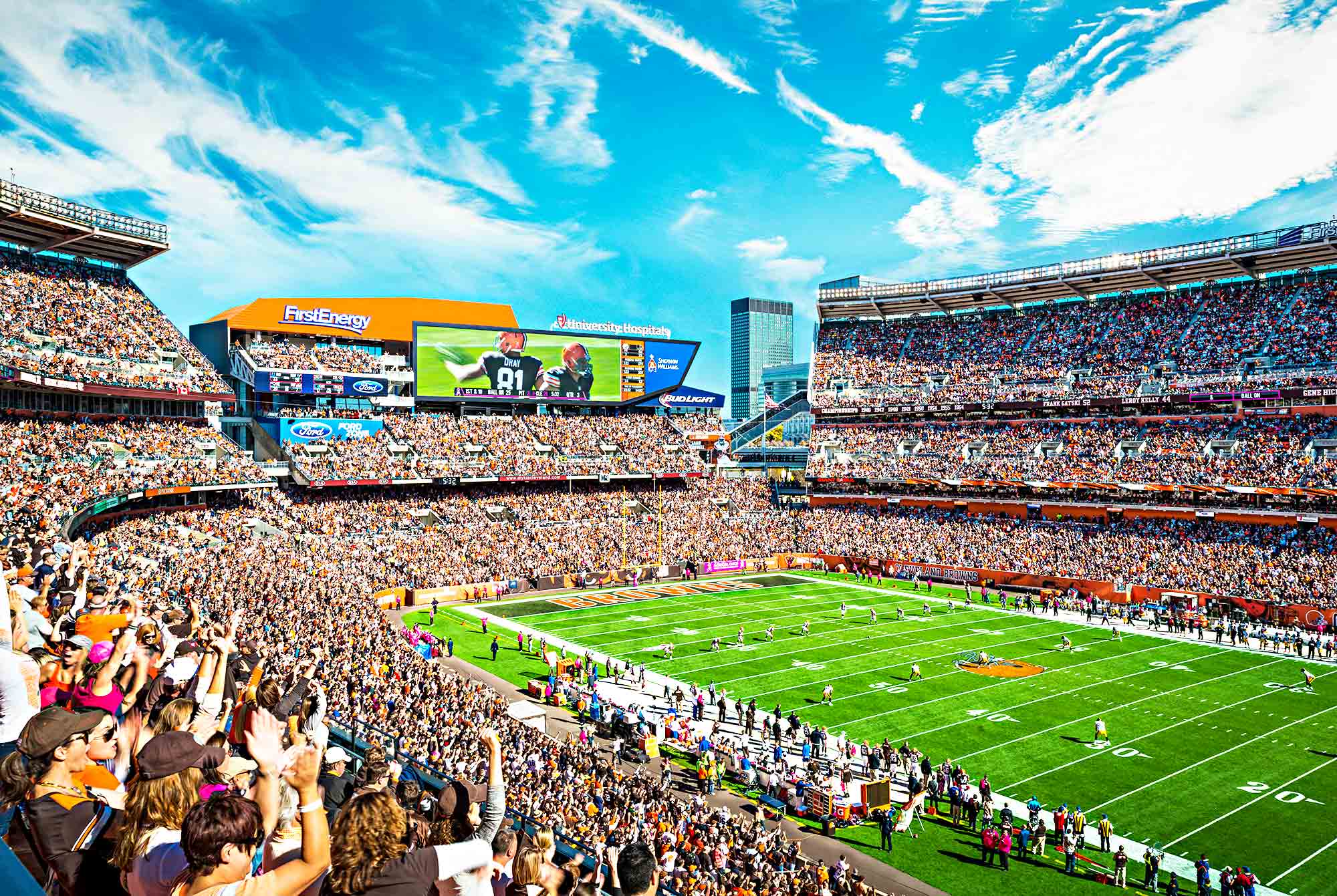 A sports stadium with a large crowd.