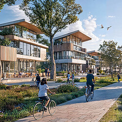 People riding bikes on a sidewalk.