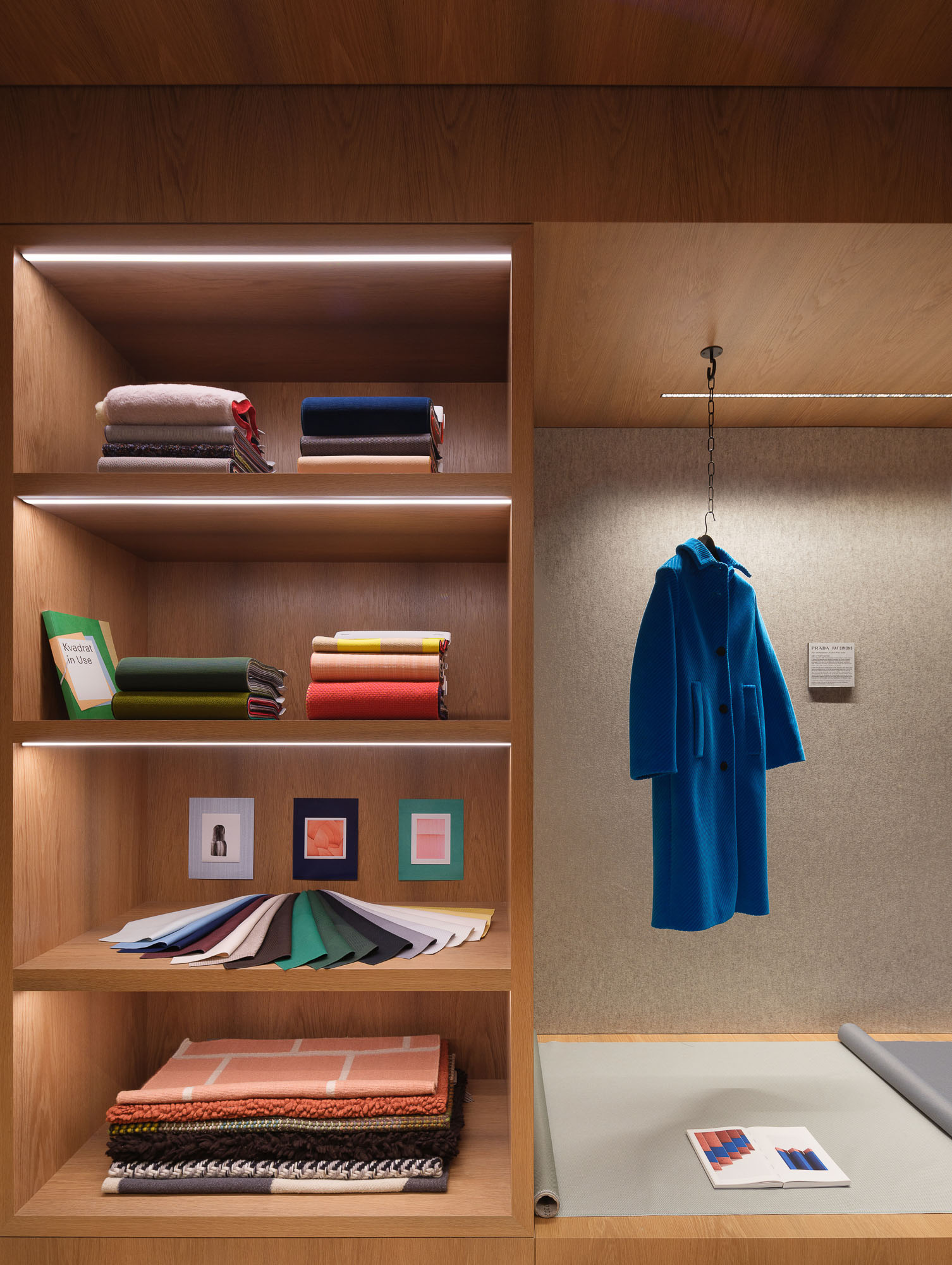 A room with books and a coat rack.