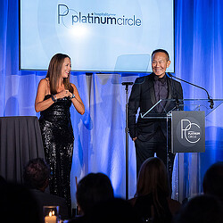 Tom Ito being honored on stage as a Platinum Circle Inductee