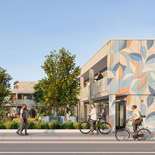 A group of people walking on the sidewalk next to a building.