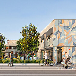A group of people walking on the sidewalk next to a building.