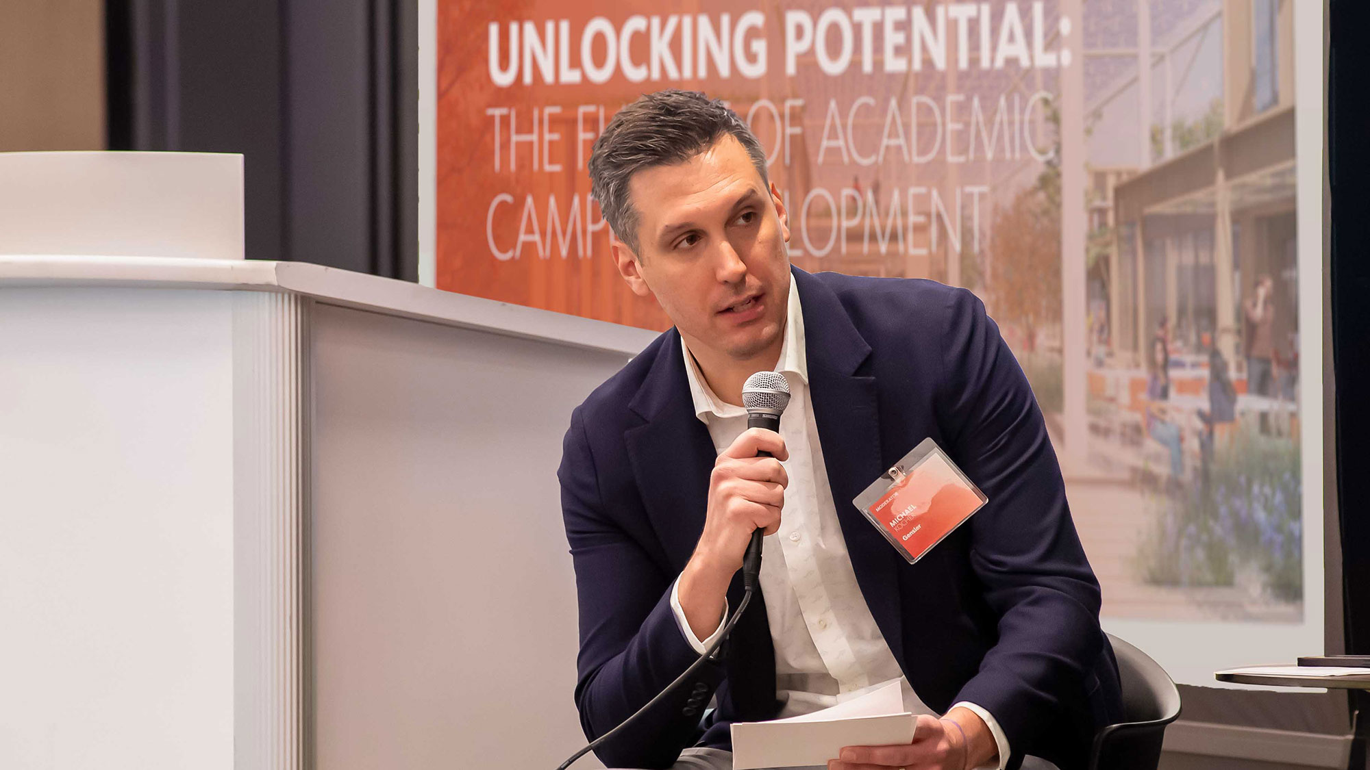 A man speaking into a microphone.