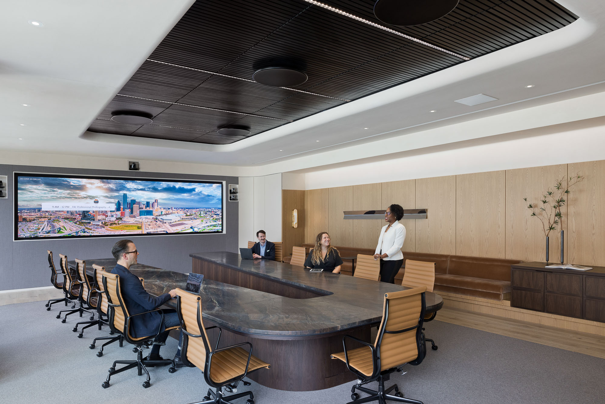 A group of people in a conference room.
