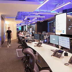 A room with computers and people.