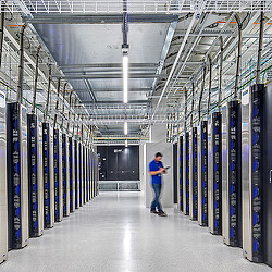 A person standing in a warehouse.