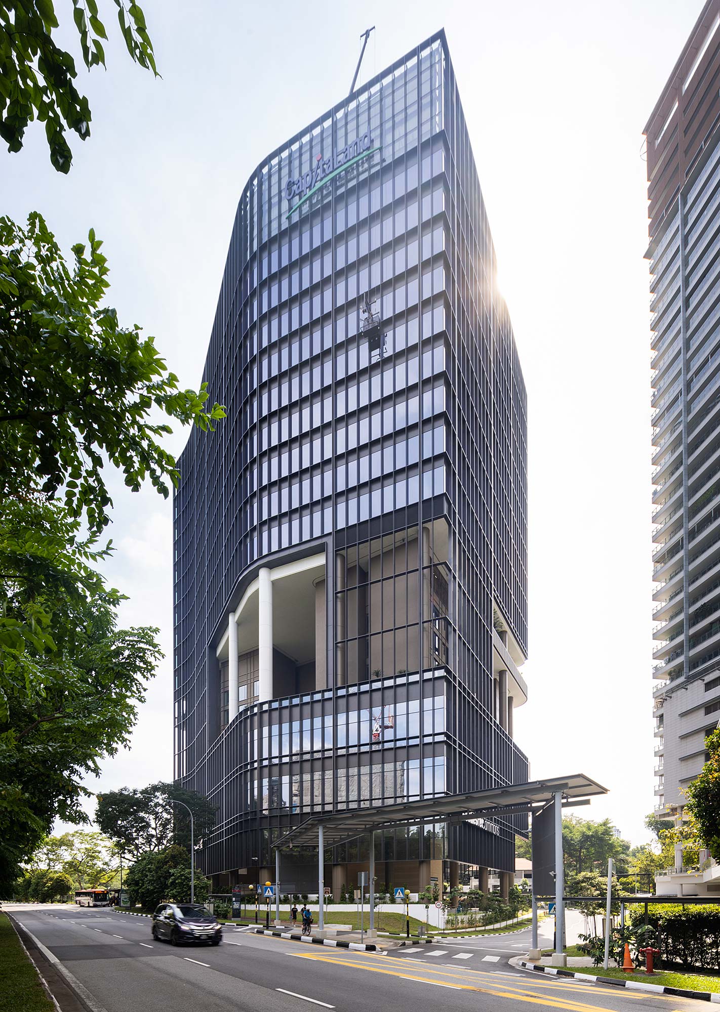 A tall building with a street below.