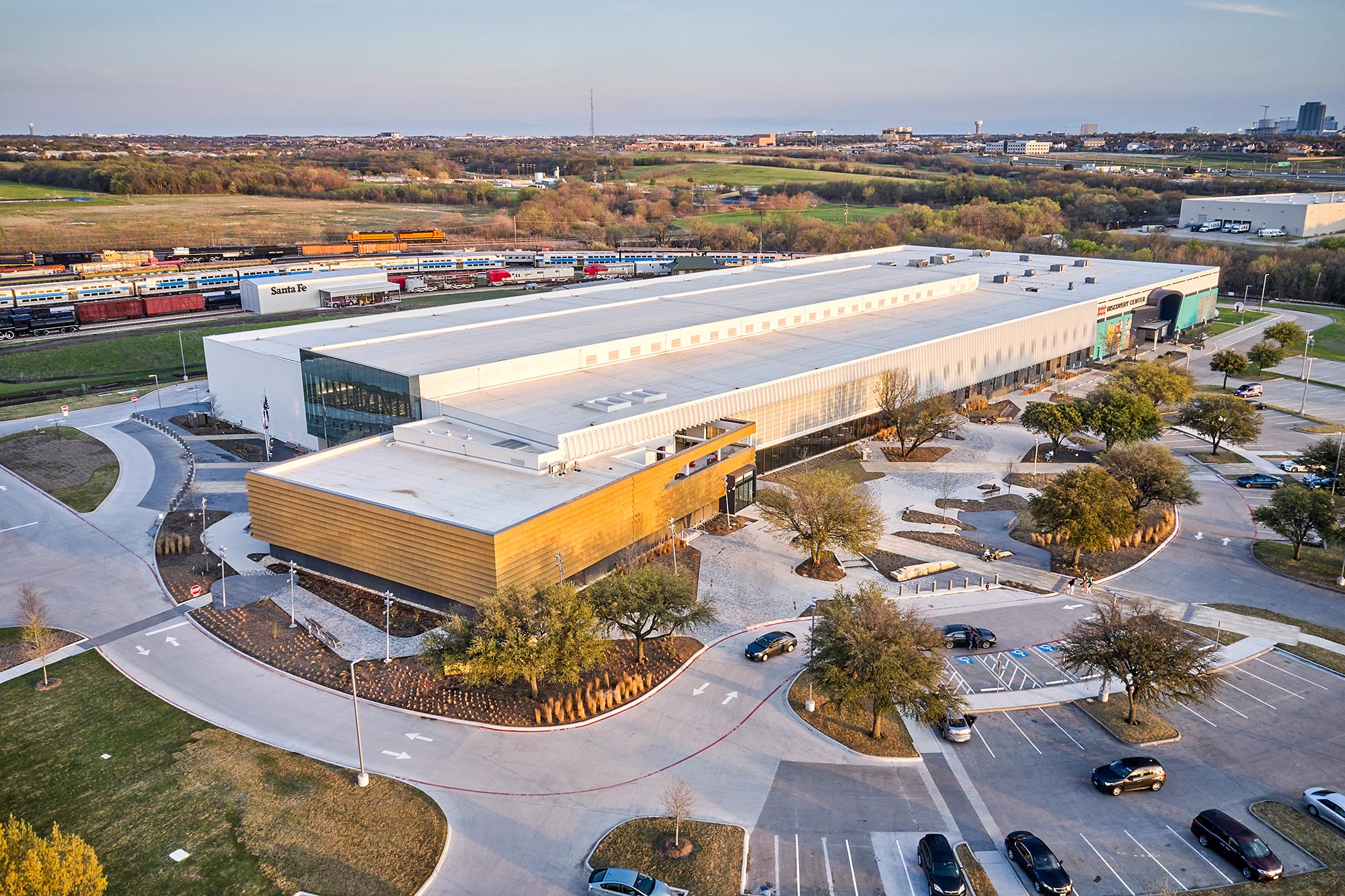 A large building with a parking lot.