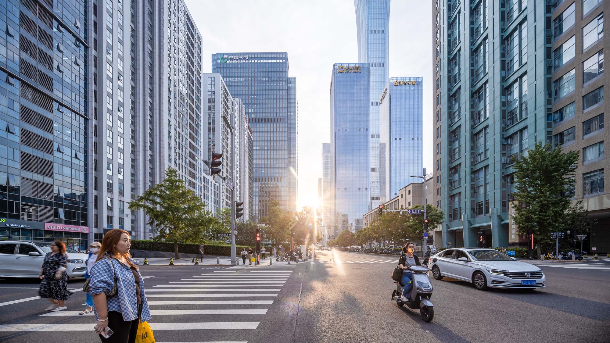 A person walking across a crosswalk in Beijing