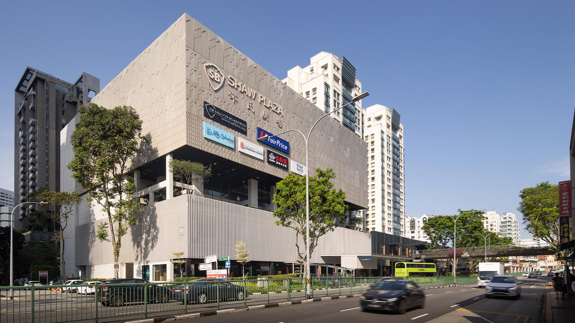 A large building with a street in front of it.