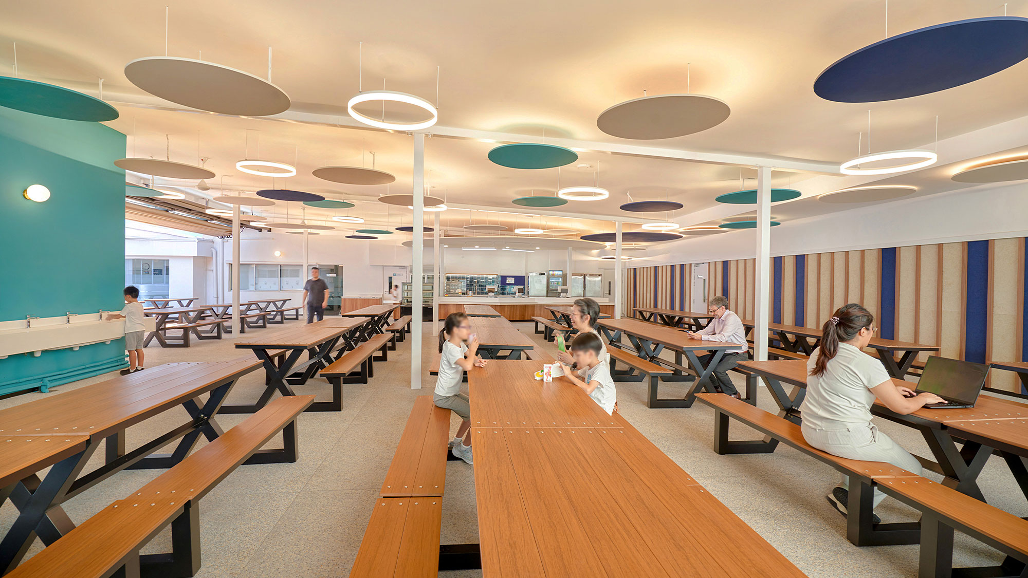 A group of people sitting at tables.
