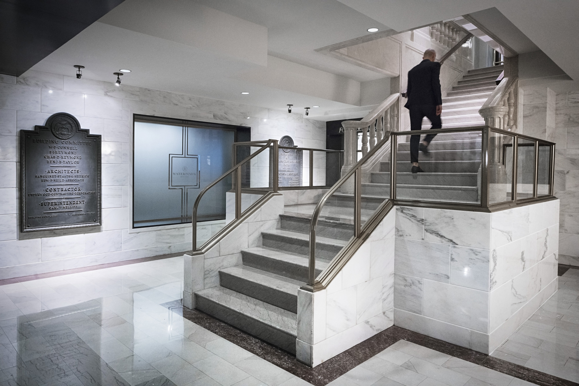 A man walking up a flight of stairs.
