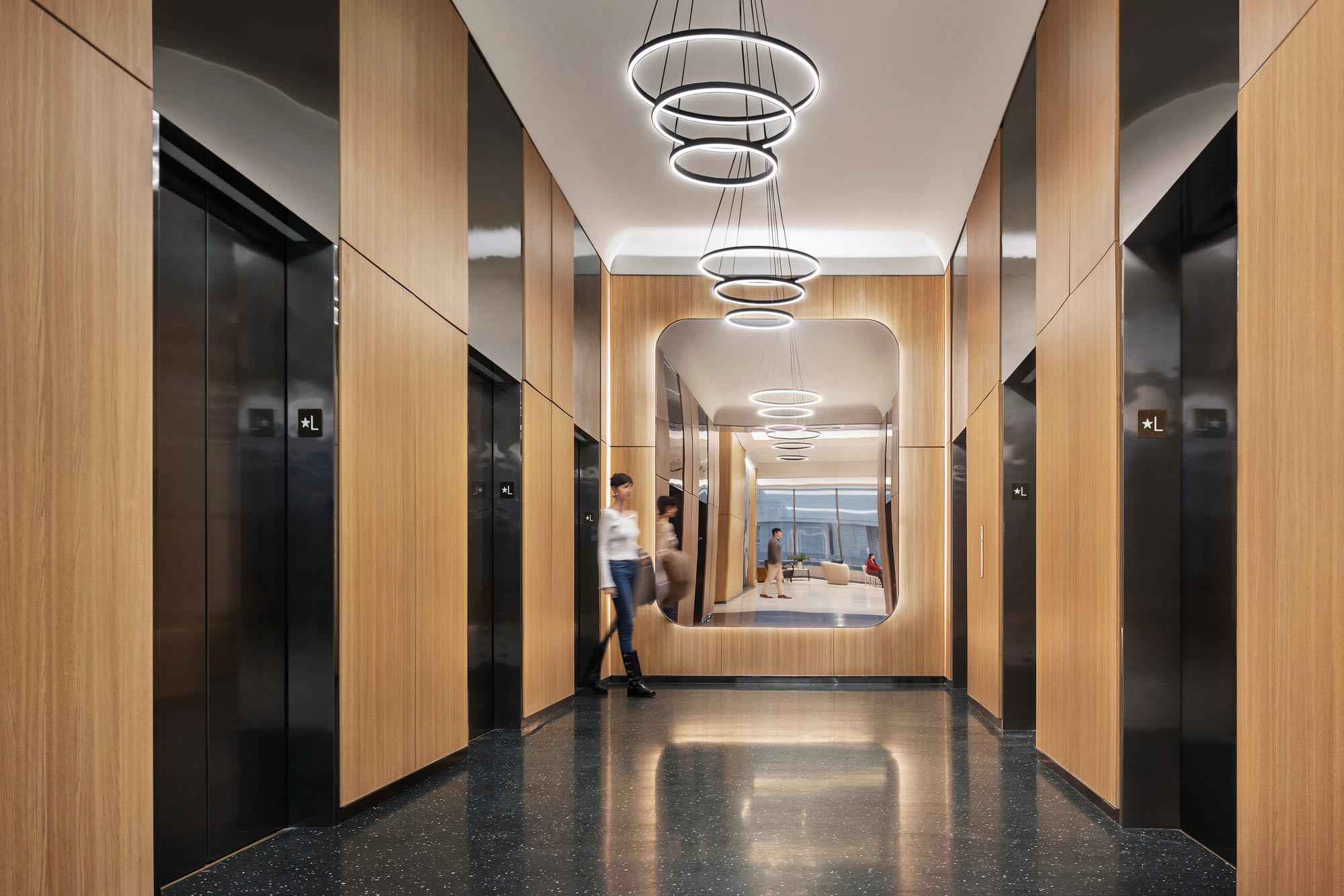 A person walking through a hallway.