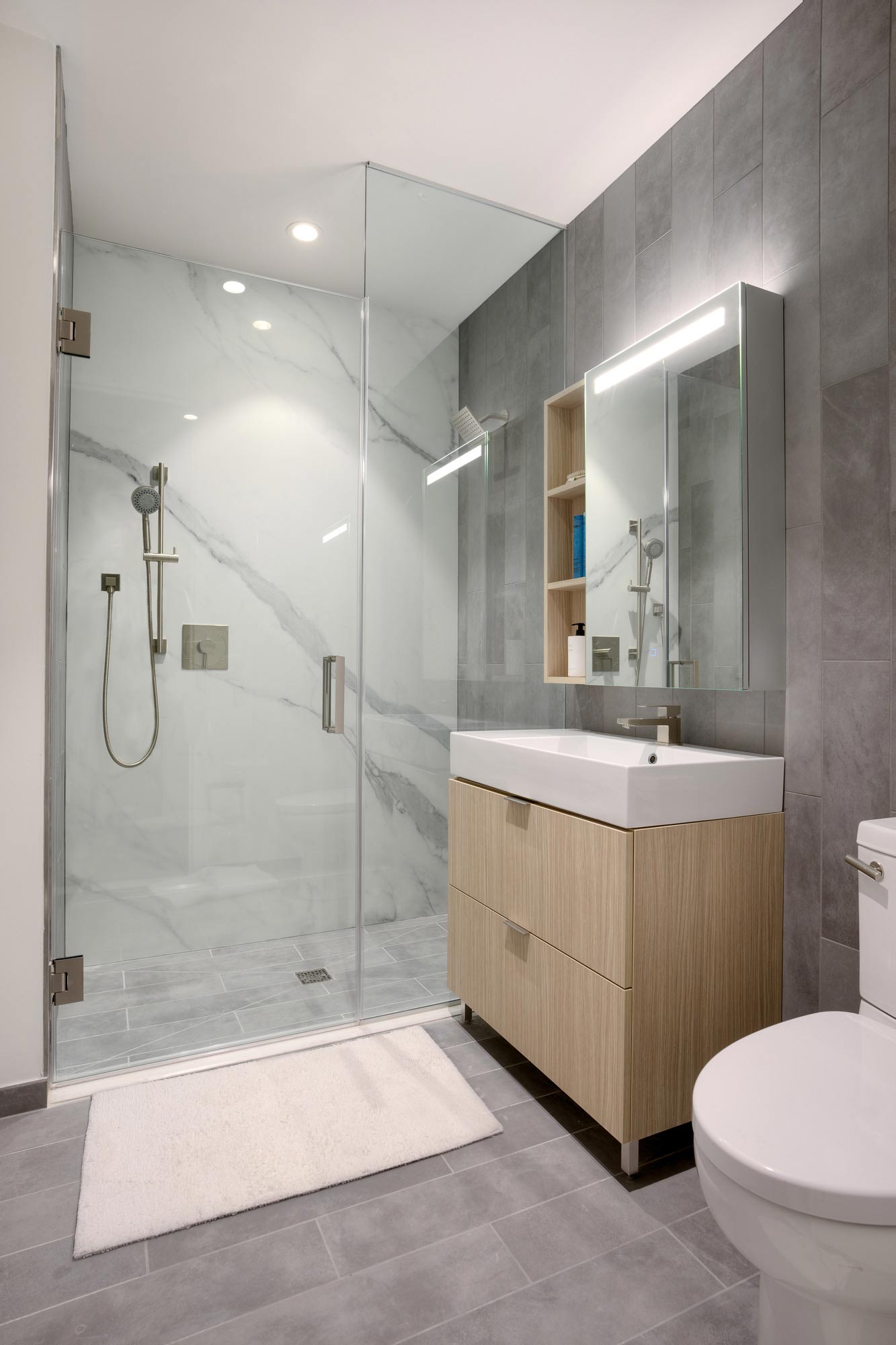 A bathroom with a glass shower.
