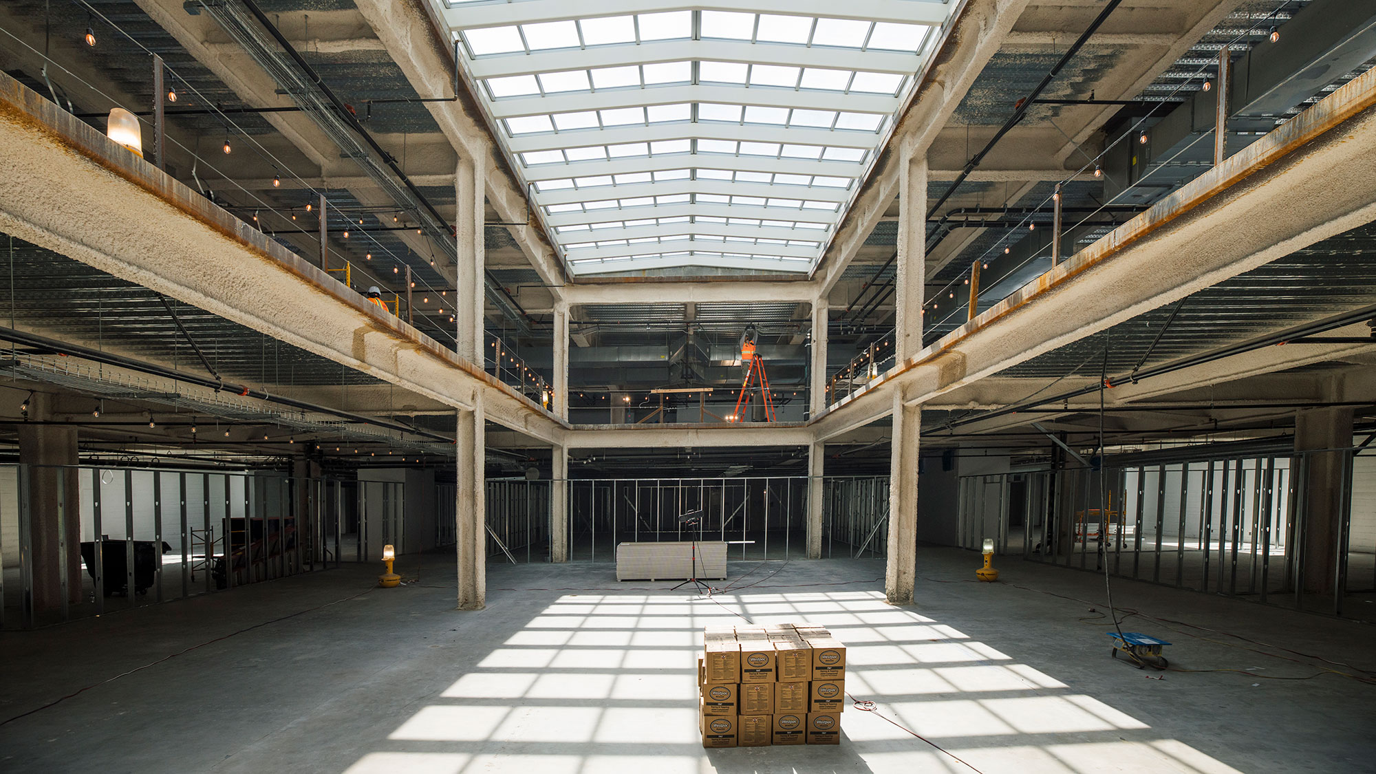 A large warehouse with a few boxes.