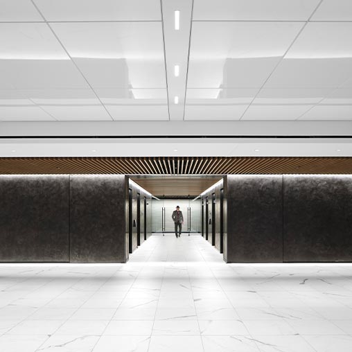 A person walking in a hallway.