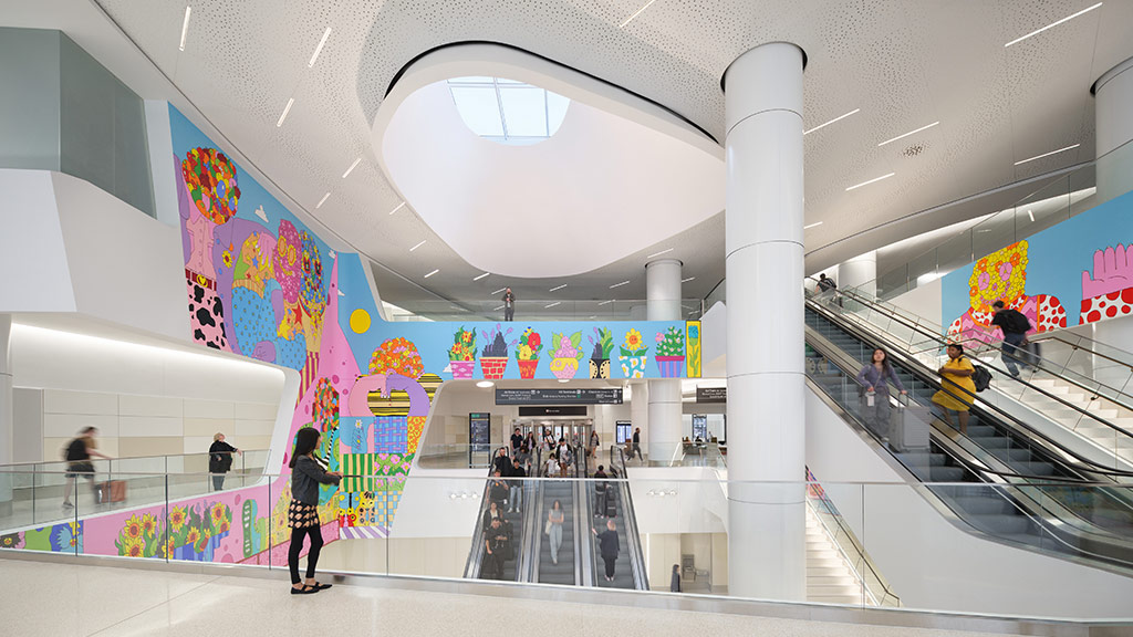 SFO Harvey Milk Terminal 1 colorful mural and skylight by escalators