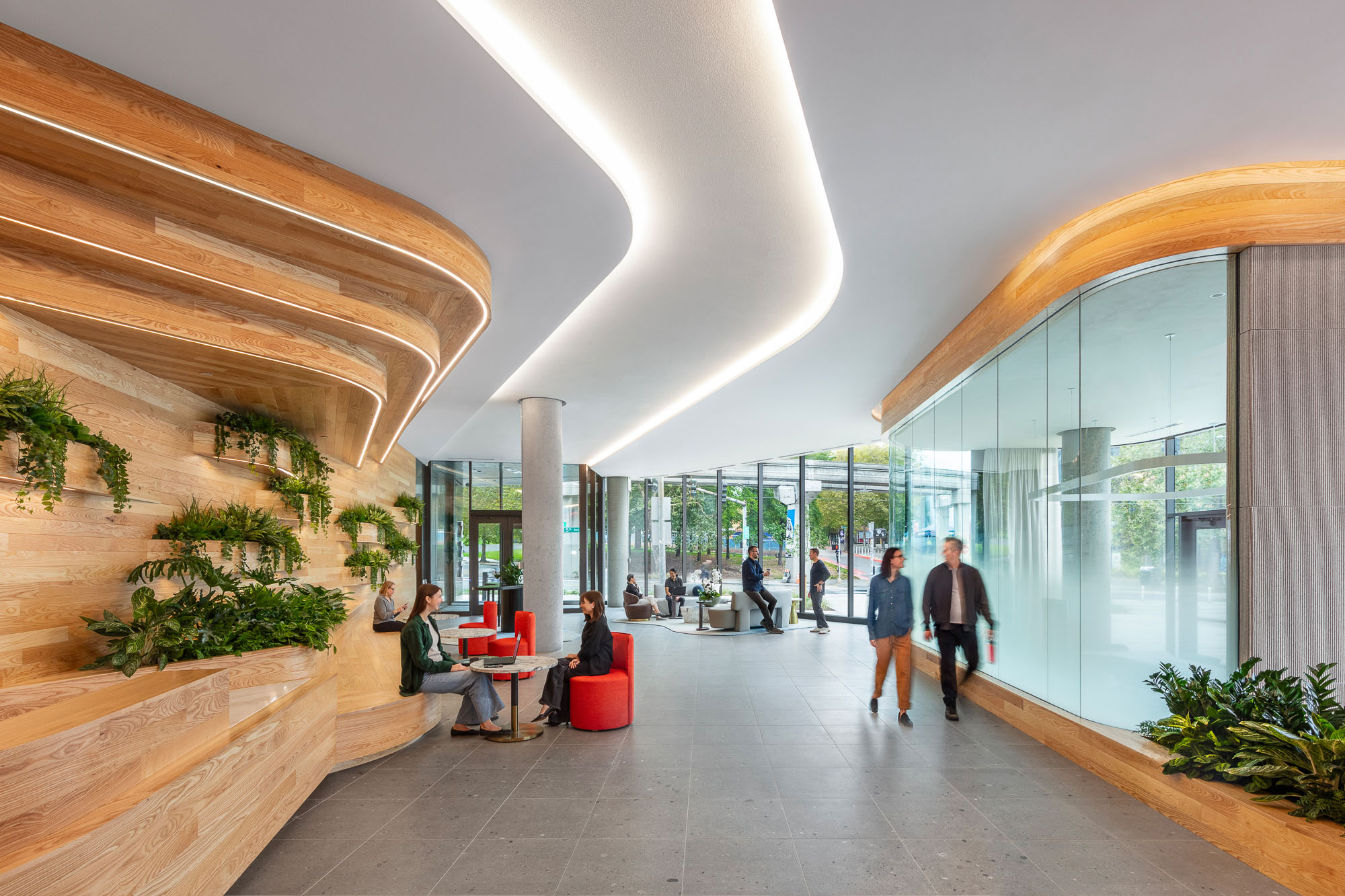A group of people walking inside a building.