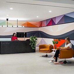 A couple of women are working in the Vancouver office space.