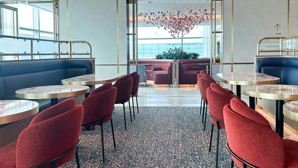 An airport lounge room with tables and chairs. Credit: Carolina Gazal/CNN Underscored.