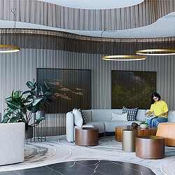 A person sitting in the lounge area of Ontario's Teachers' Pension Plan.