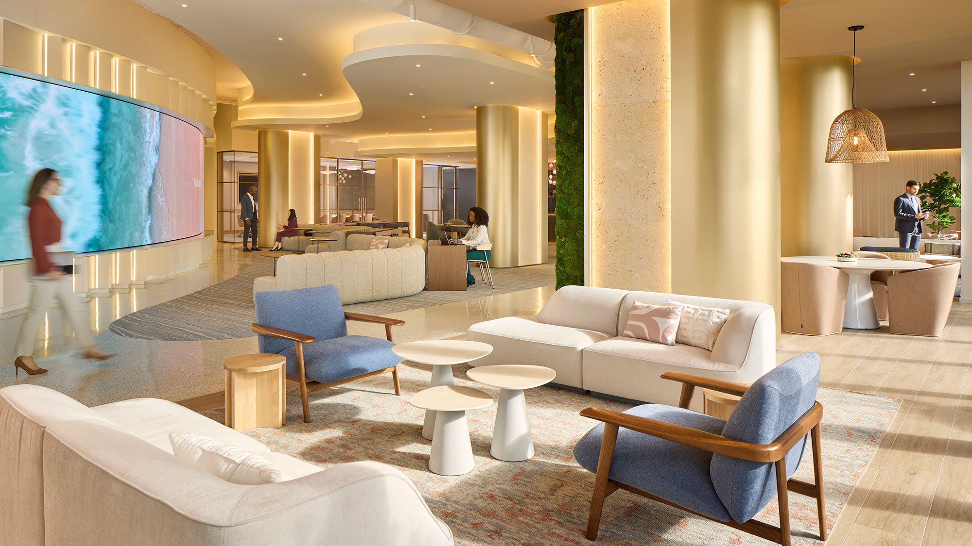 A room with white couches and chairs.