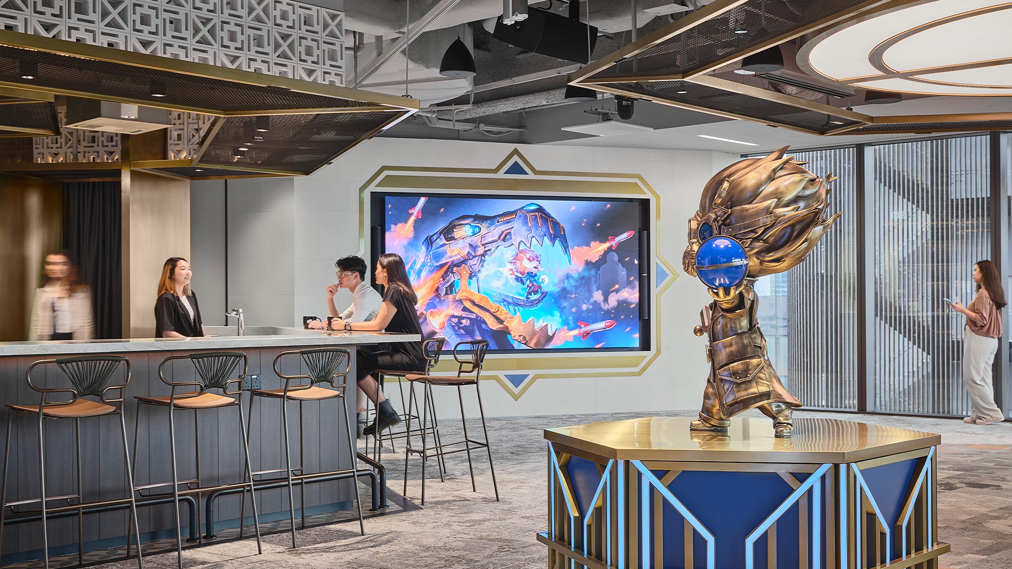 People in a room with a large robot.