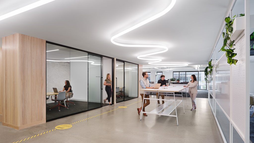 Crusoe Energy collaboration space with wavy ceiling light