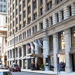 Kimpton Gray Hotel building in a bustling landmark area.