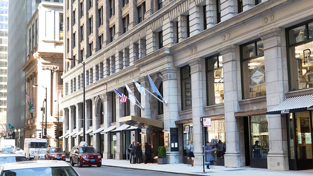 Kimpton Gray Hotel building in a bustling landmark area.