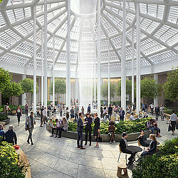 A group of people in a large building with a glass roof.