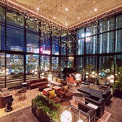 The Gate Hotel Tokyo lounge with nighttime city views