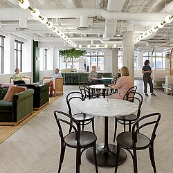 A group of people sitting at tables.